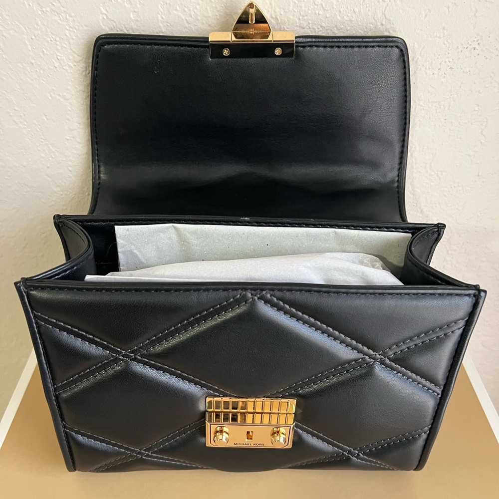 Micheal kors 
Serena Small Quilted Faux Leather Crossbody Bag